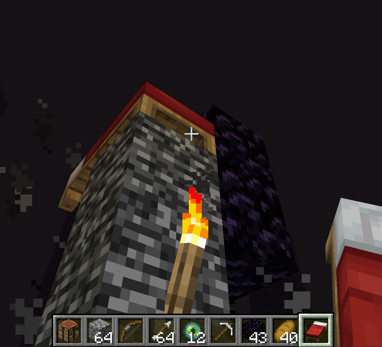 Bed explosion setup on the bedrock portal with a blast-shield block beside the dragon's head