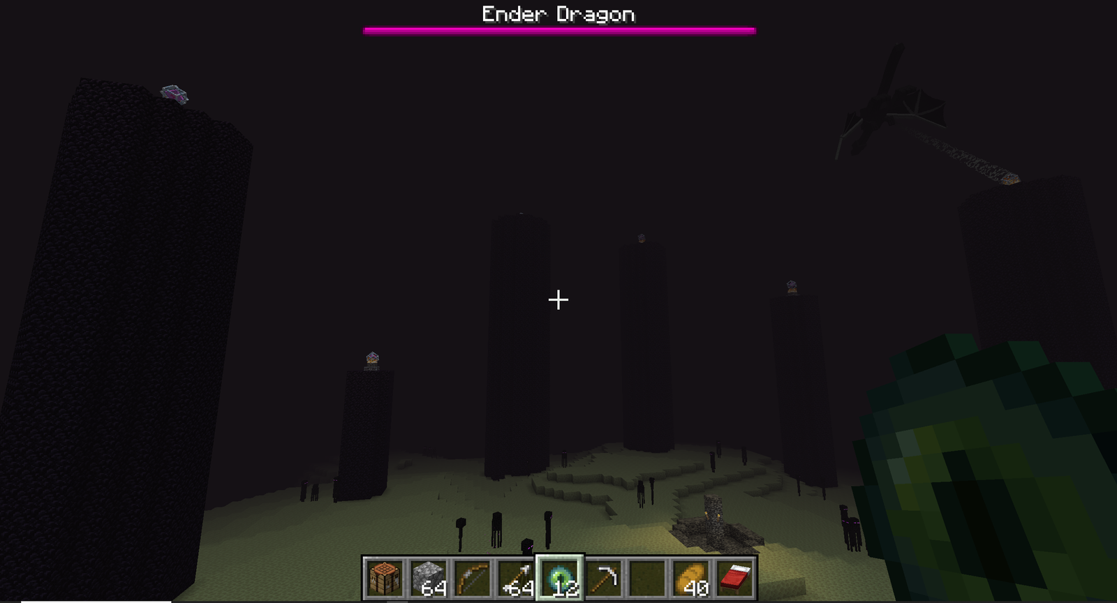 Arriving in the End: obsidian pillars topped with end crystals ringing the central portal